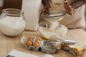 Someone measuring backing ingredients 